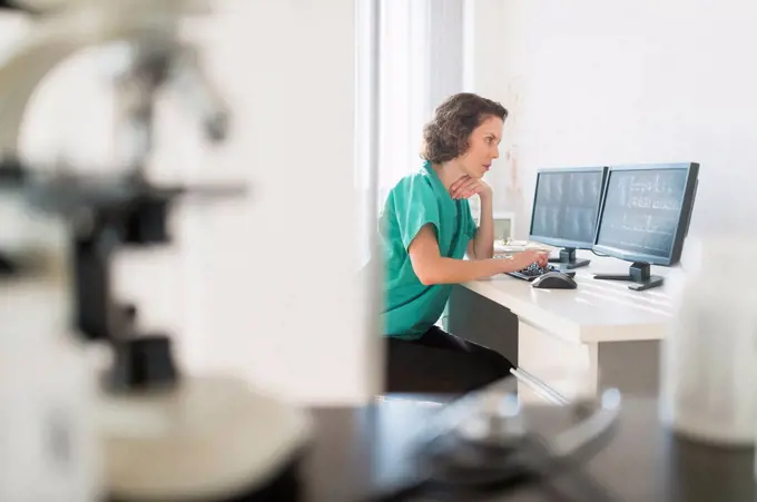 Female technician working on computer