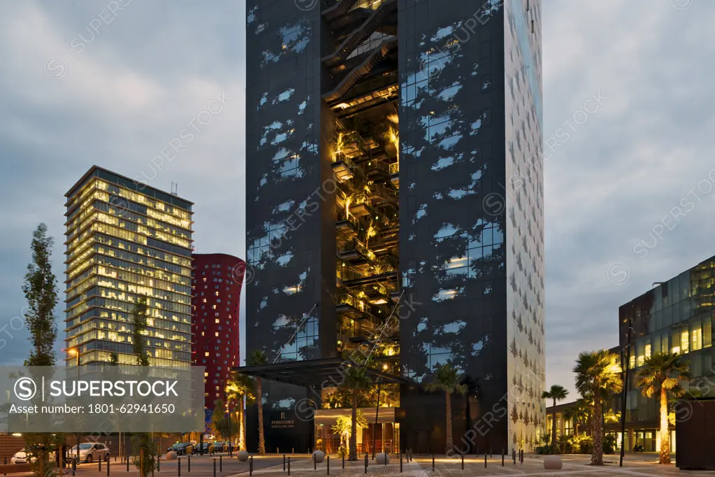 Renaissance Barcelona Fira Hotel, Barcelona, Spain. Architect: Jean Nouvel, 2012. Evening view of front elevation and entrance.