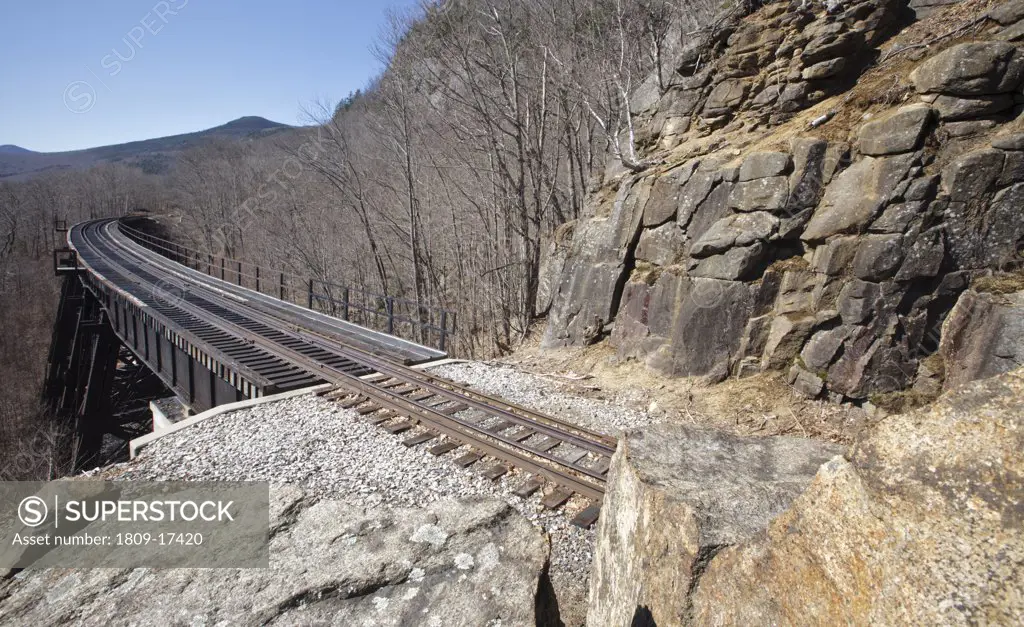 Crawford Notch State Park - Frankenstein Trestle  along the Maine Central Railroad in the White Mountains, New Hampshire USA. Chartered in 1867 as the Portland & Ogdensburg Railroad Company then leased to the Maine Central Railroad in 1888 and later aband