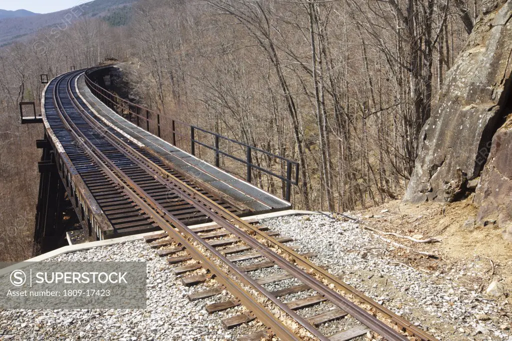 Crawford Notch State Park - Frankenstein Trestle  along the Maine Central Railroad in the White Mountains, New Hampshire USA. Chartered in 1867 as the Portland & Ogdensburg Railroad Company then leased to the Maine Central Railroad in 1888 and later aband