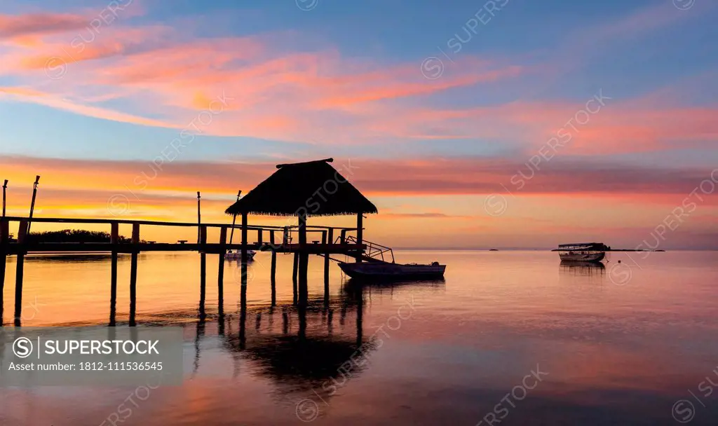 Pier off Malolo Island at sunrise into the South Pacific Ocean; Malolo Island, Fiji