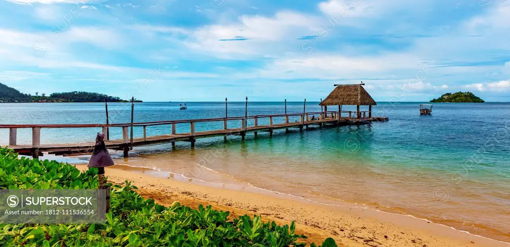 Pier off Malolo Island at sunrise into the South Pacific Ocean; Malolo Island, Fiji