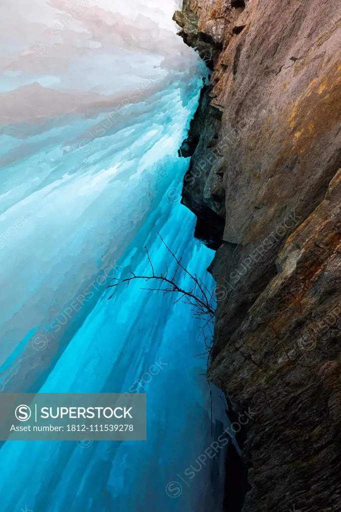 View behind a frozen waterfall in the Alaska Range; Alaska, United States of America