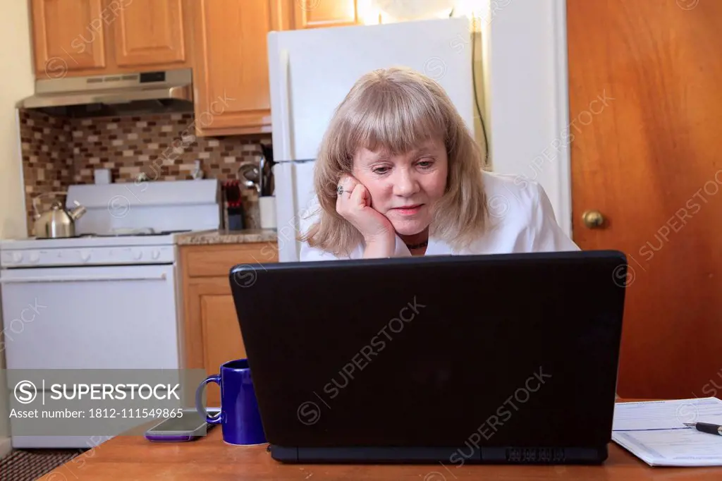 Woman with Bipolar disorder working from home on her laptop