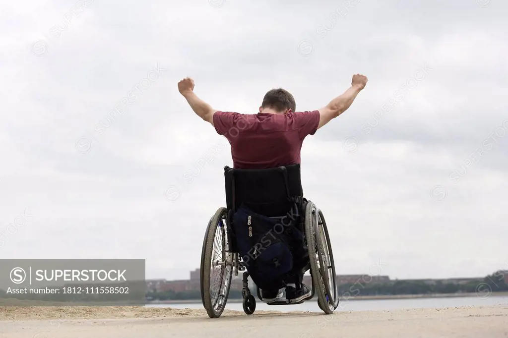 Handicapped man on a wheel chair.