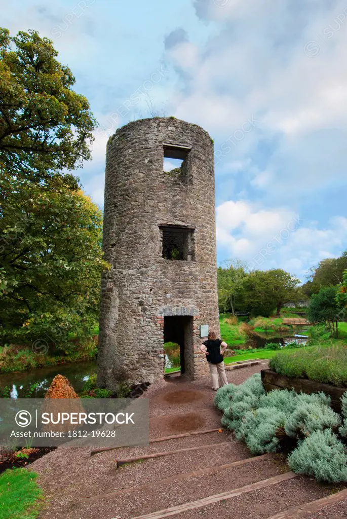 Tourist Looking At Round Tower; Blarney County Cork Ireland