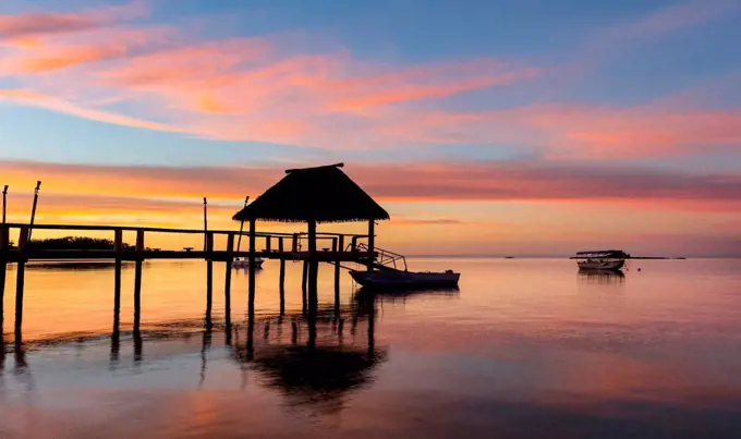 Pier off Malolo Island at sunrise into the South Pacific Ocean; Malolo Island, Fiji