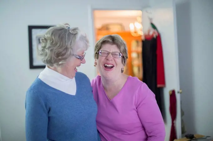 Woman with Autism smiling with her mother