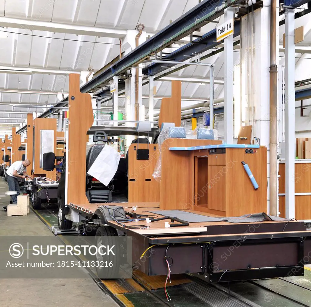 Assembly line production of motorhomes in a factory