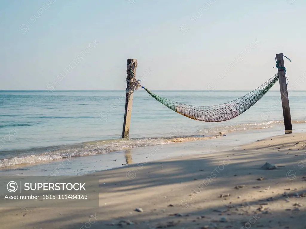 Indonesia, Bali, Gili Islands, Gili Air, Fishing net hammock on beach seen on peaceful day¶ÿ