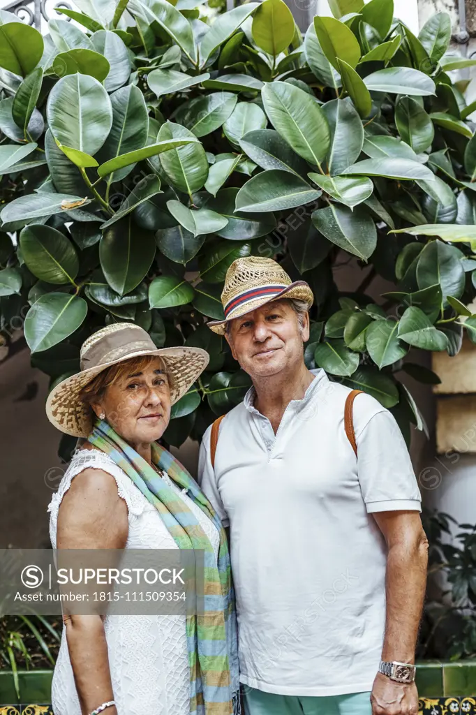 Portrait of senior couple with leaf background, El Roc de Sant Gaieta, Spain