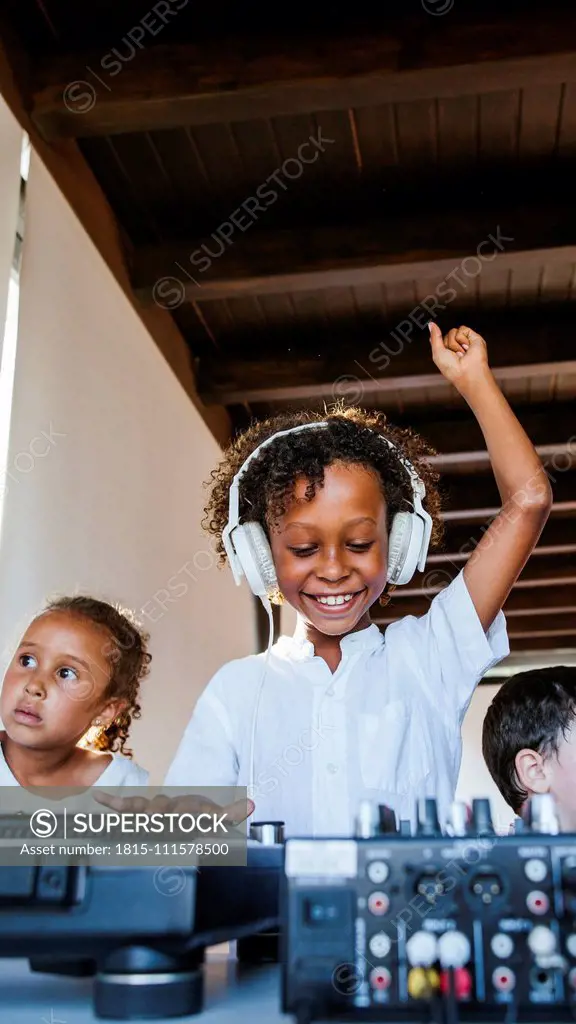 Young dj with headphones having a party