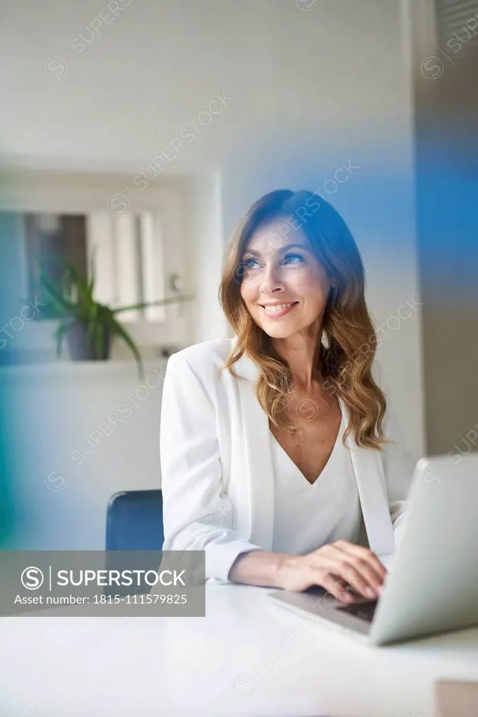 Business woman using laptop