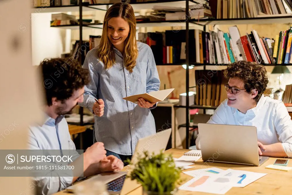 Coworkers working at desk in office