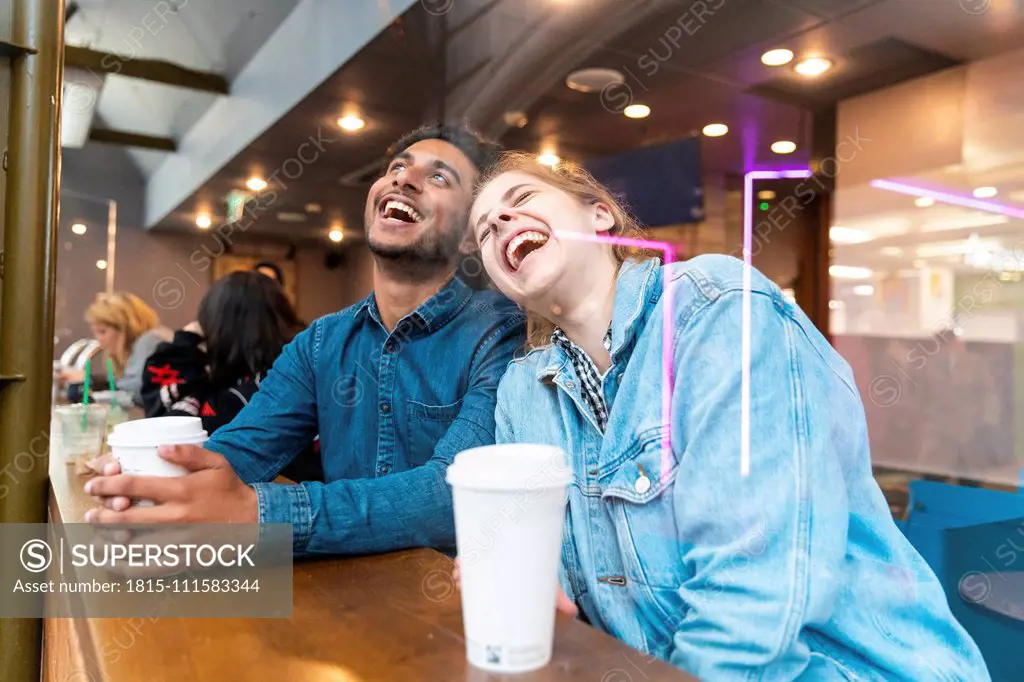 Friends having fun together in a coffee shop