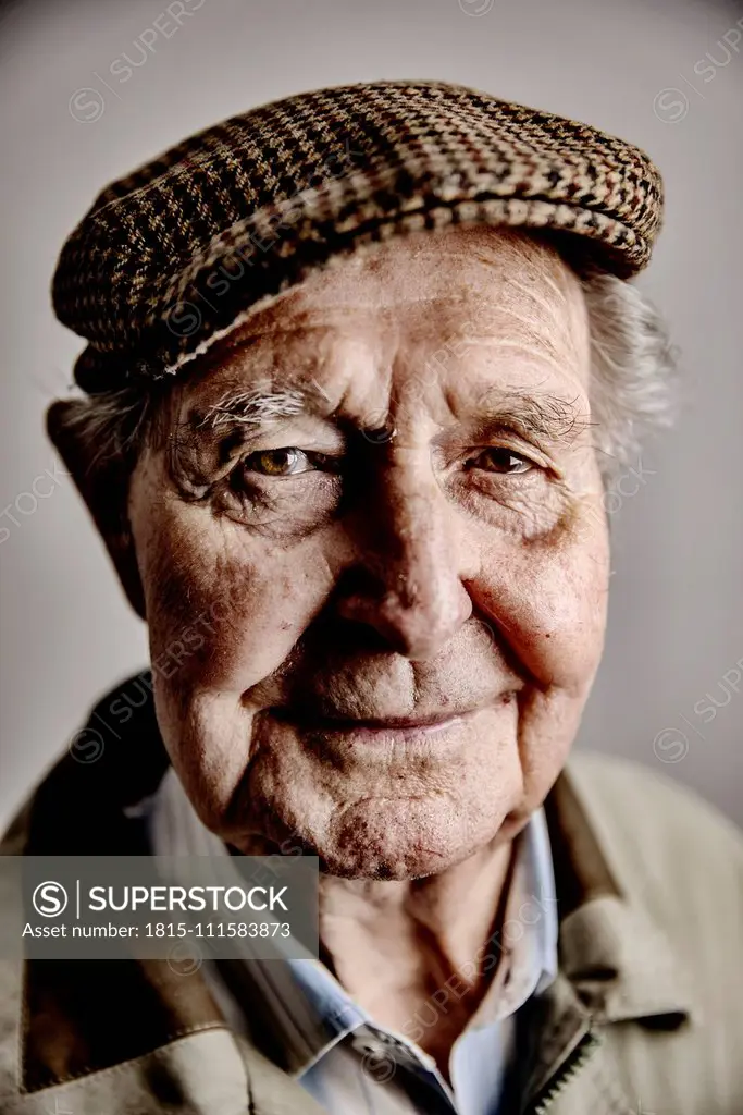 Portrait of smiling senior man wearing cap