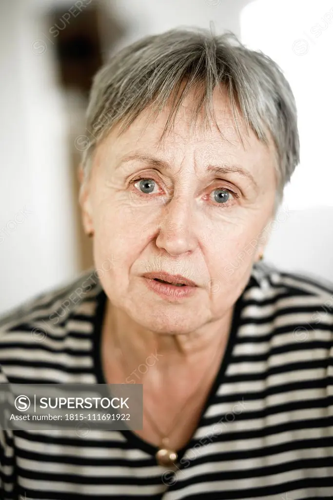 Portrait of senior woman with short hair, respectable looking in camera