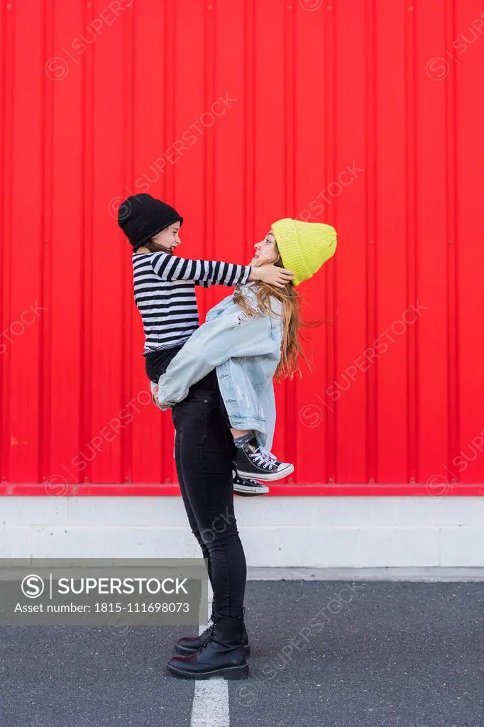 Teenage girl and younger sister having fun together