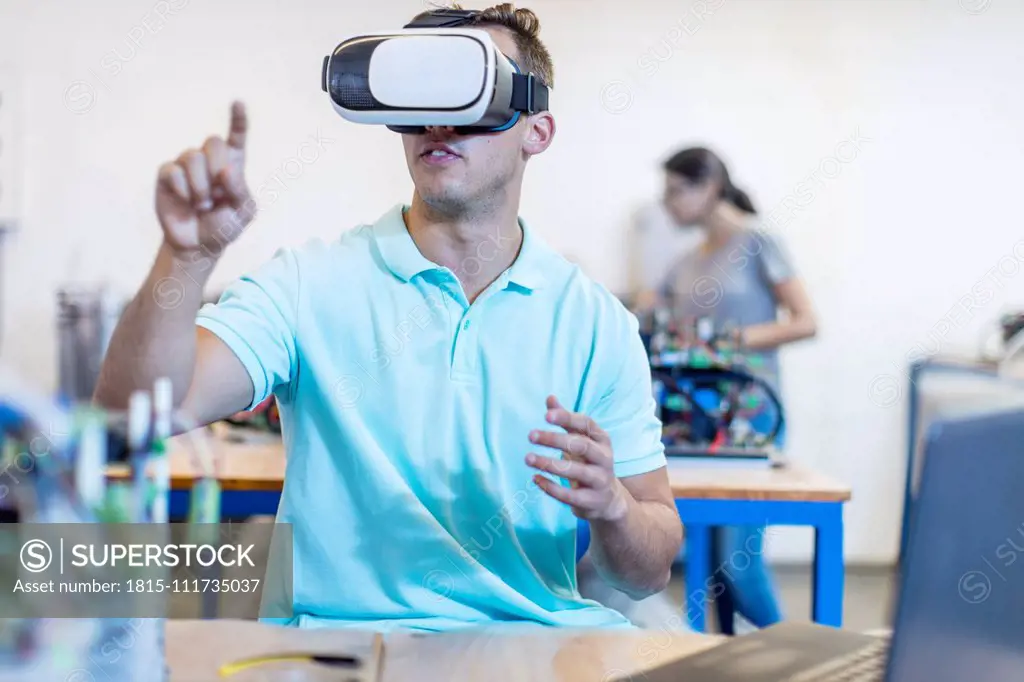 Technician using a VR headset in workshop