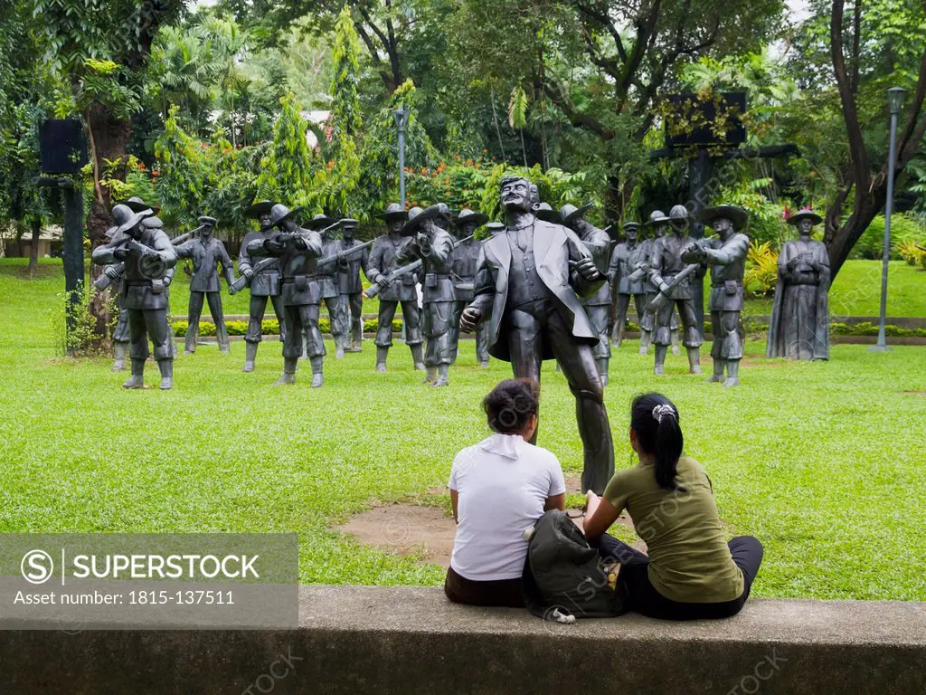 Philippines, Manila, Women at Site of Rizal's Execution in Rizal Park