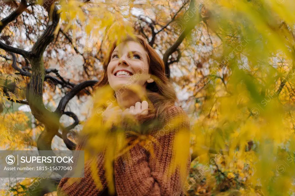 Portrait of a happy woman in autumn