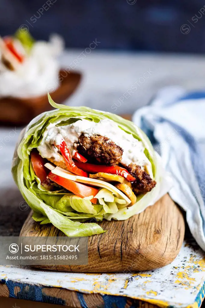 Low¶ÿcarb¶ÿburger with bun salad, roasted vegetables and¶ÿtzatziki¶ÿsauce