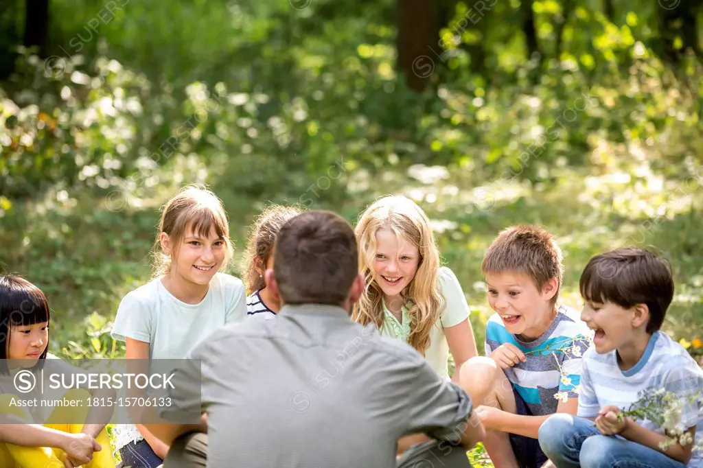 School children learning to to distinguish different plants