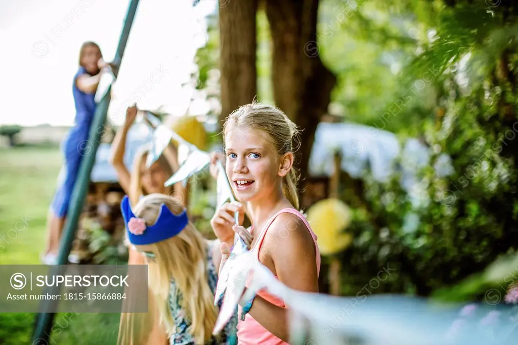 Girls decorating the garden for a birthday party