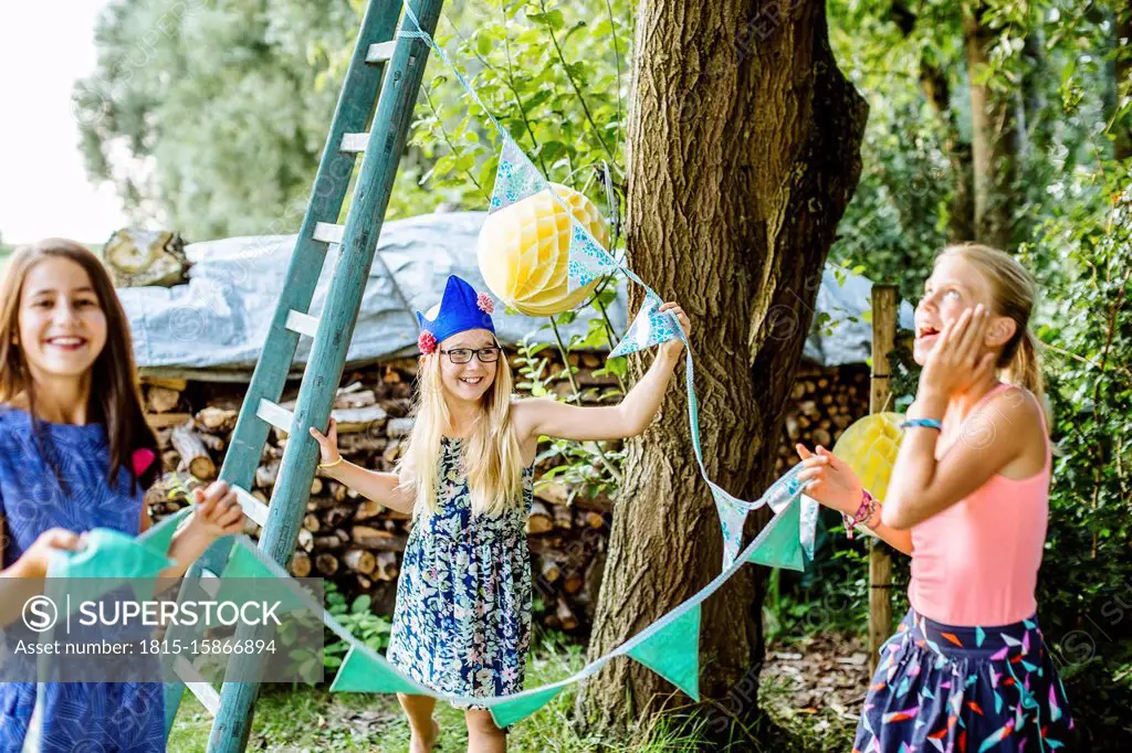 Girls decorating the garden for a birthday party