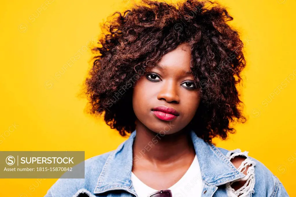 Portrait of beautiful serious young woman in studio