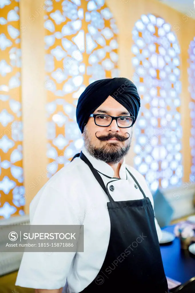 Portrait of Indian chef in restaurant