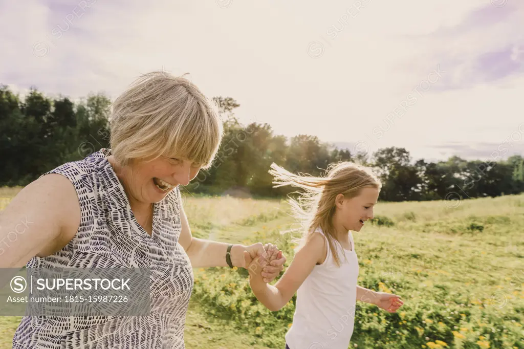 Grandmother and granddaughter roller skating