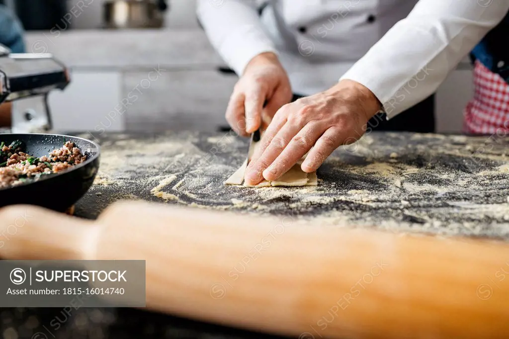 Close-up of man preparing homemade gluten free pasta