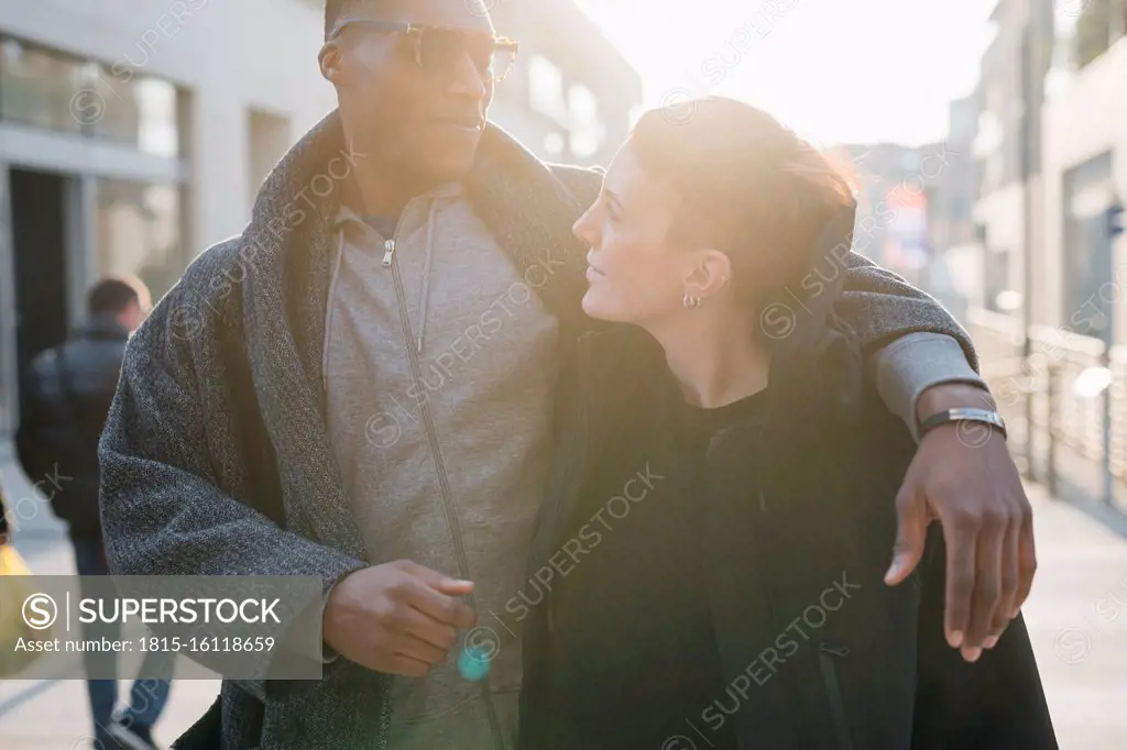 Young couple in the city at sunset