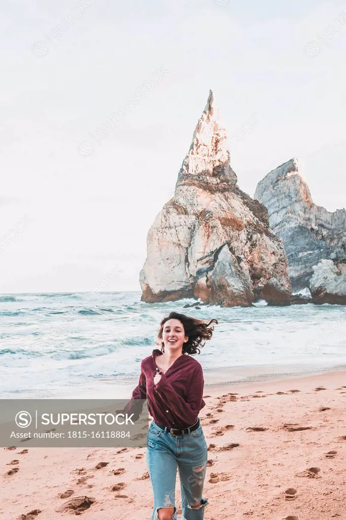 Young woman at Praia da Ursa, Lisboa, Portugal