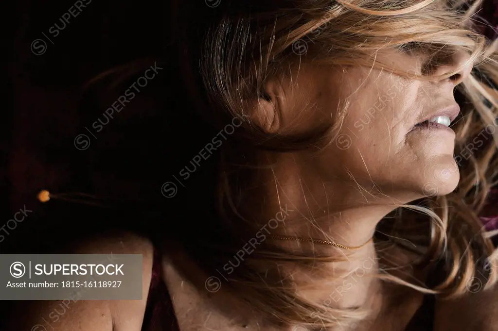 Close-up of a senior woman with tousled hair