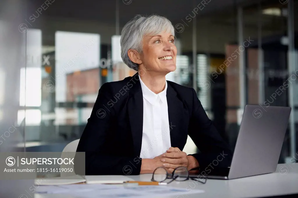 Senior businesswoman at desk in her office