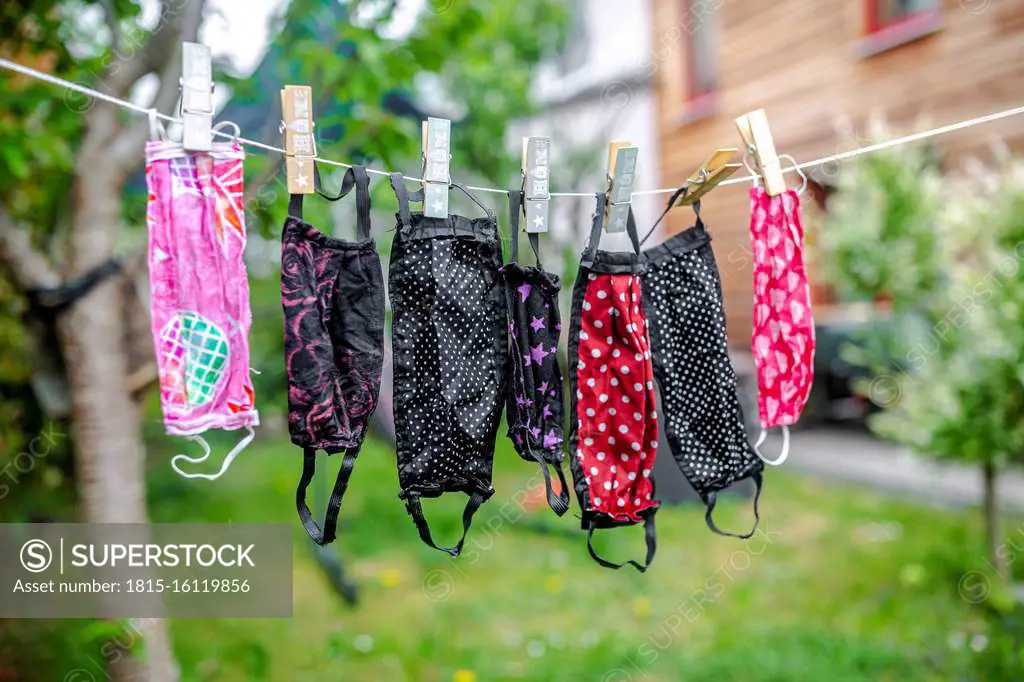 Surgical masks hanging on clothesline