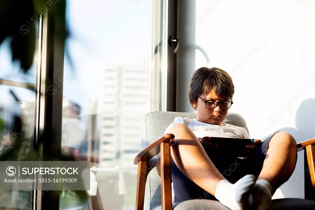 Boy playing video game on a games console