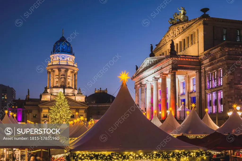 Germany, Berlin, Christmas market at Gendarmenmarkt in front of the Concert Hall right and German Cathedral