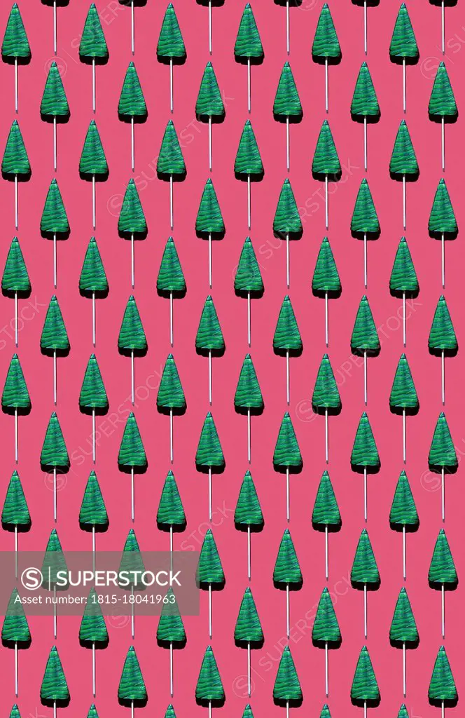 Pattern of¶ÿtree-shaped¶ÿlollipops against red background