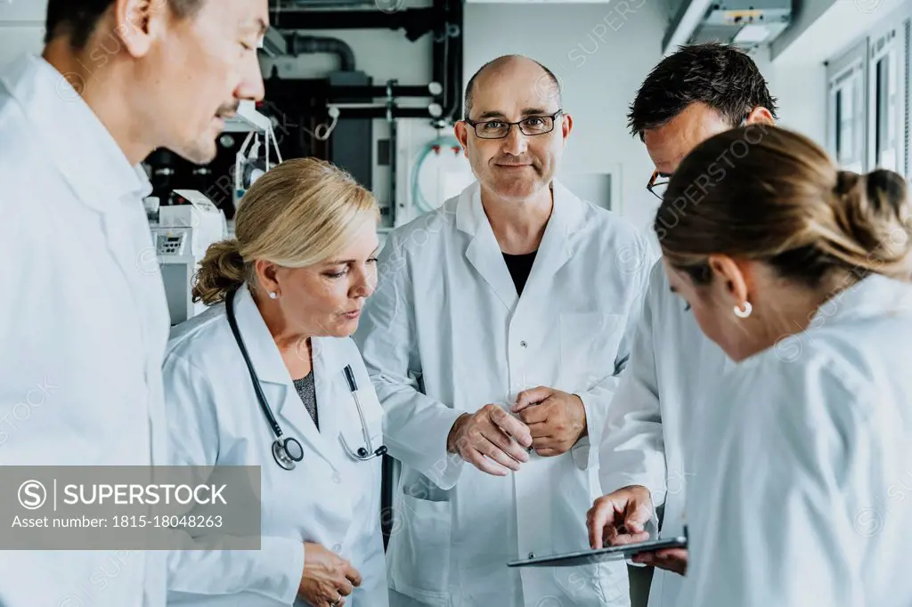 Scientist concentrating while working on digital tablet at laboratory