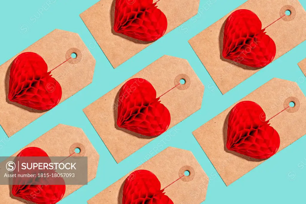 Pattern of labels with heart shaped paper craft decorations