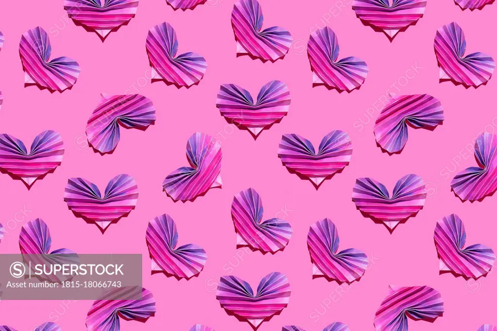 Pattern of pink and purple origami hearts