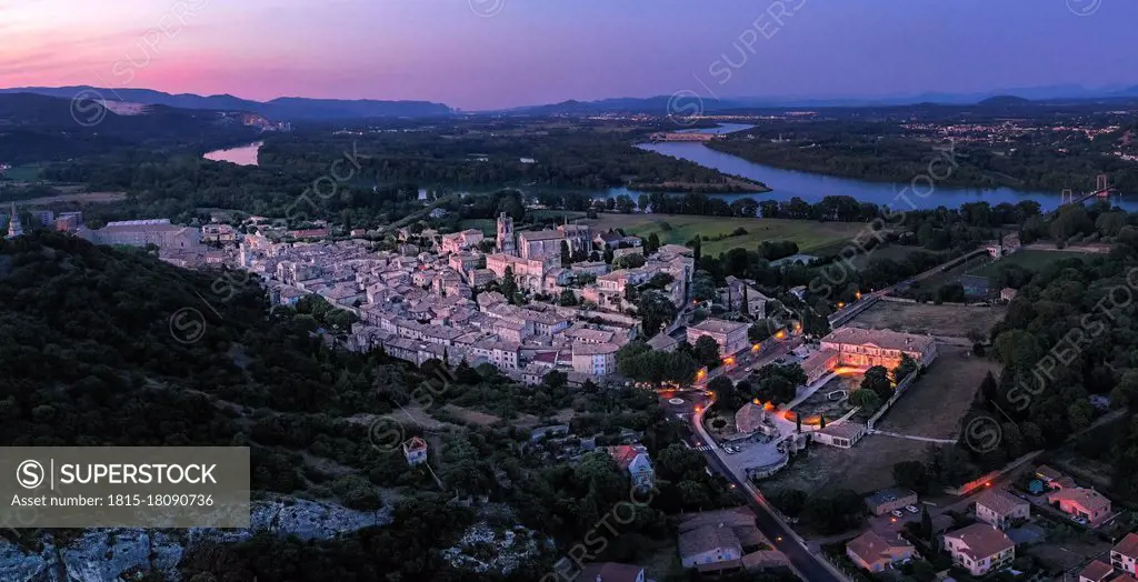 France, Ardeche, Aerial view of medieval town at dusk