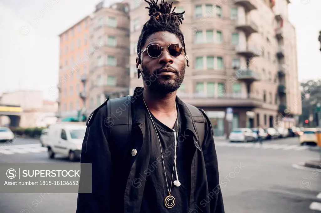 Young man with sunglasses in city