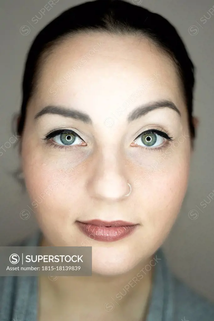 Beautiful woman with gray eyes wearing nose ring