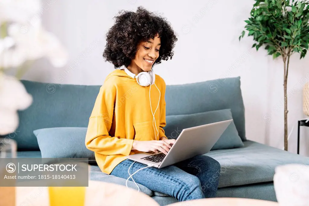 Young woman using laptop at home