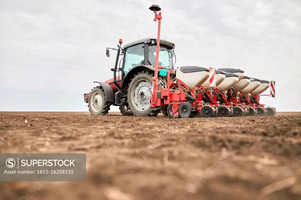 Tractor on plowed field