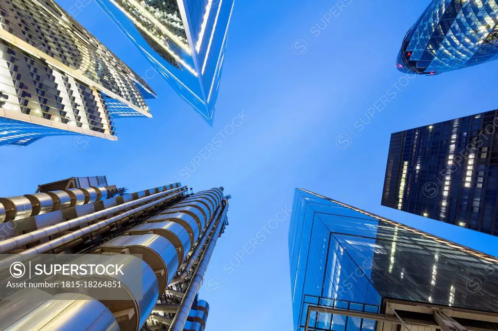 UK, England, London, Blue sky over tall skyscrapers at dusk